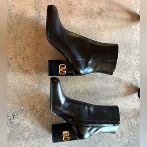 Valentino Garavani Black Heeled Boots with Gold Emblem
